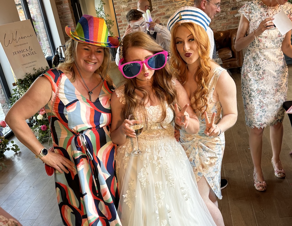 Wedding guests enjoying the Magic Mirror at Thirsk Lodge Barns